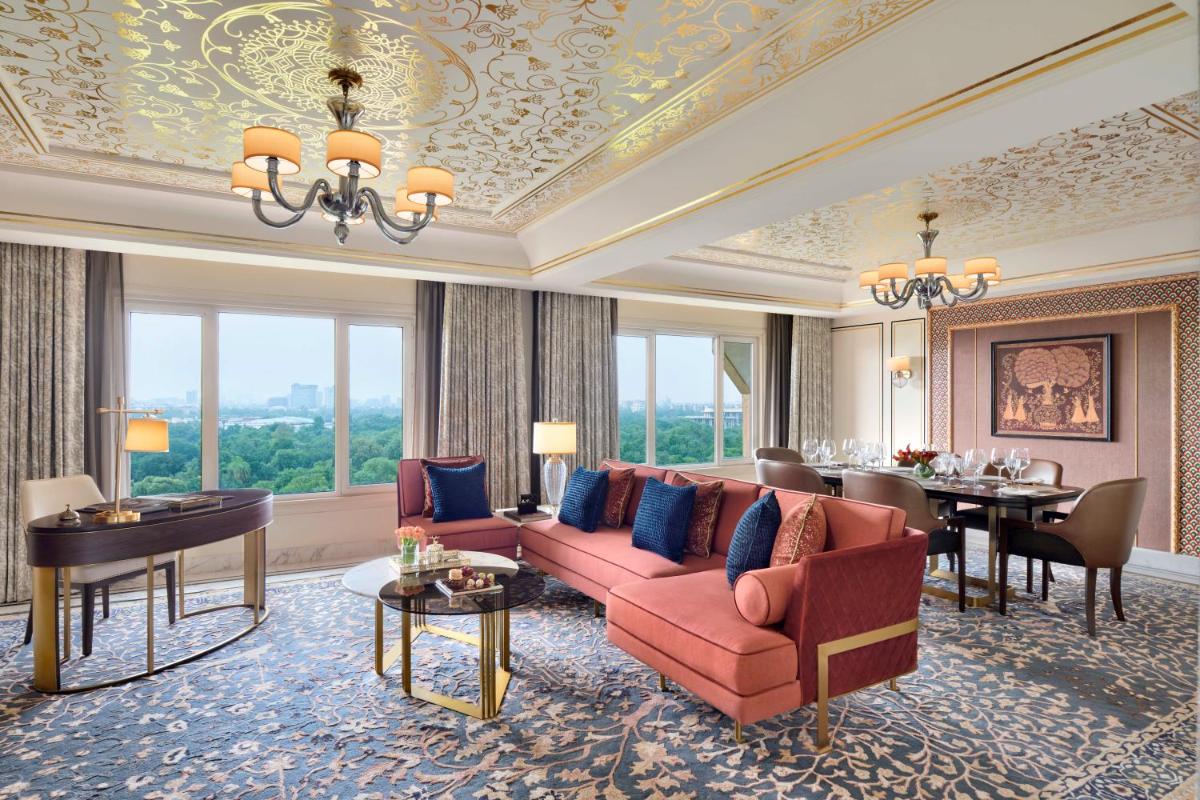 a living room with a couch and a dining room at Taj Mahal, New Delhi in New Delhi