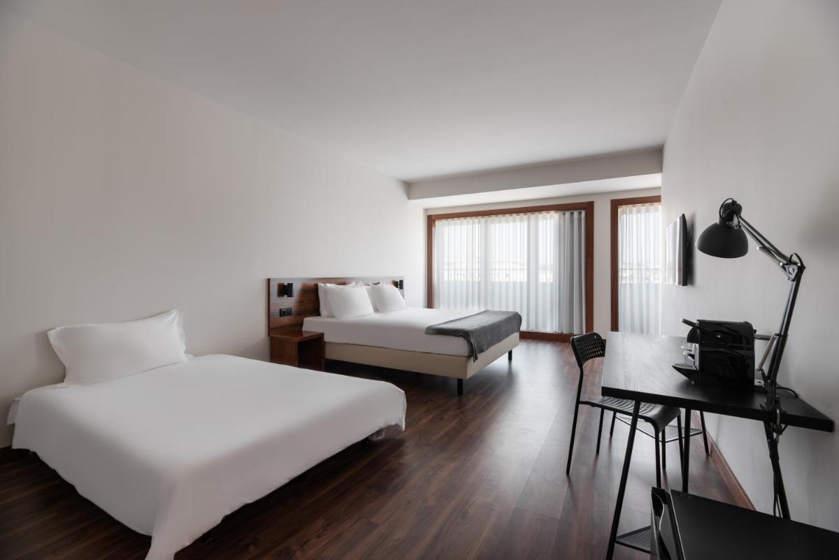 Uma cama ou camas num quarto em Dorma Praia Golfe