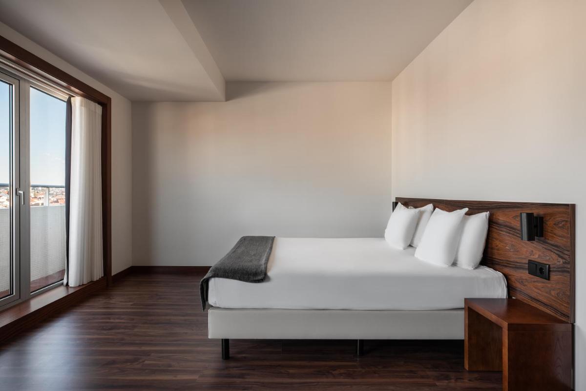 Uma cama ou camas num quarto em Dorma Praia Golfe