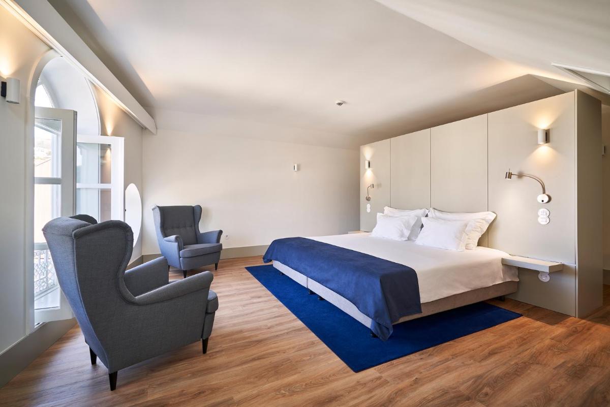 Uma cama ou camas num quarto em Ribeira Collection Hotel by Piamonte Hotels