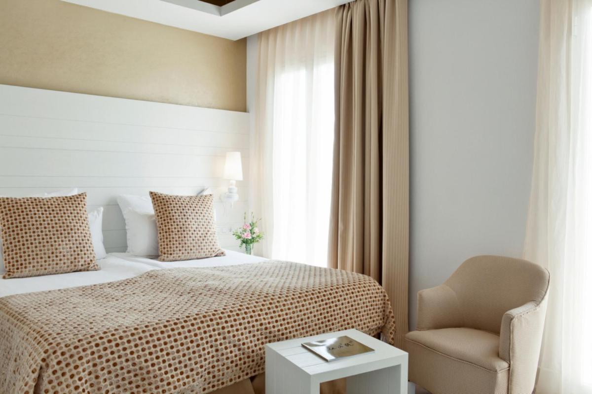 Cama o camas de una habitación en Hotel Illa d'Or & Club Apts 4* Sup