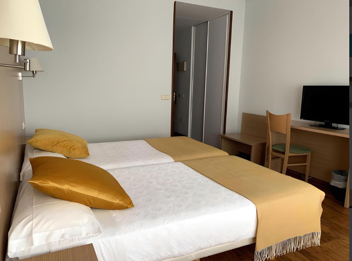 Cama o camas de una habitación en Hotel San Millán