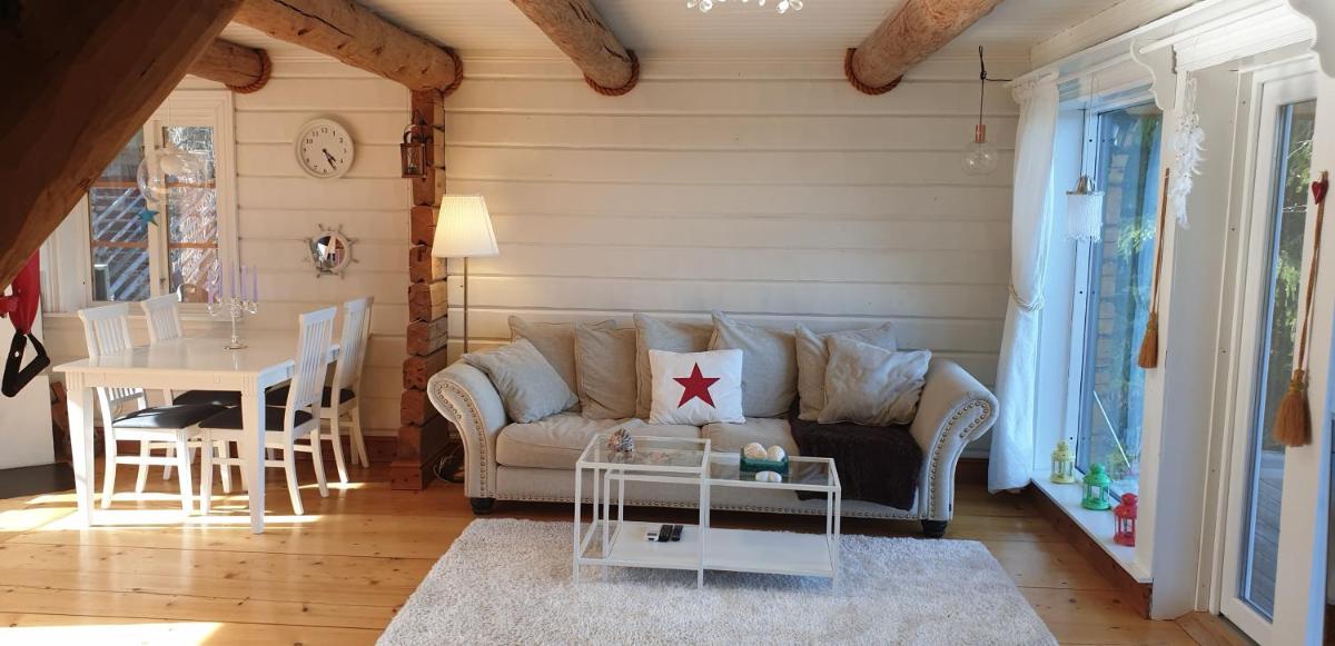 Timber house with private beach and boat including. - Housity
