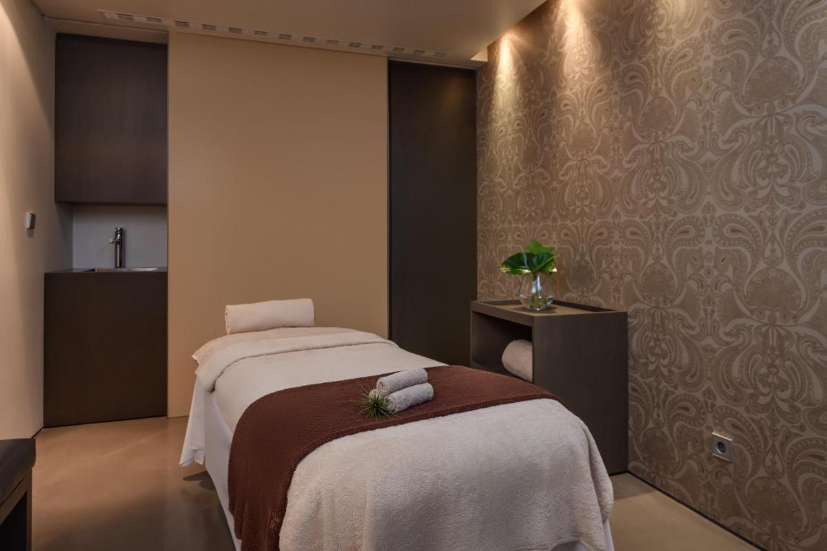 Uma cama ou camas num quarto em Inspira Liberdade Boutique Hotel