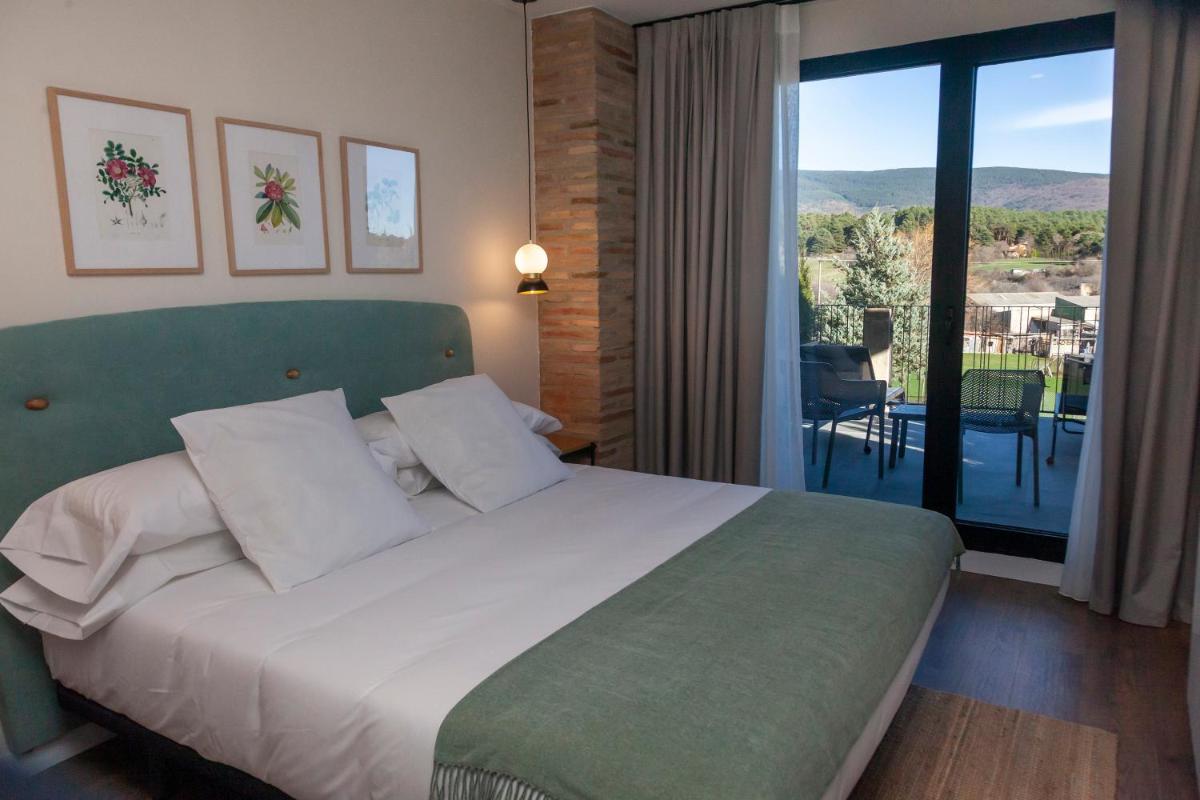 Cama o camas de una habitación en Duruelo Mountain Suites