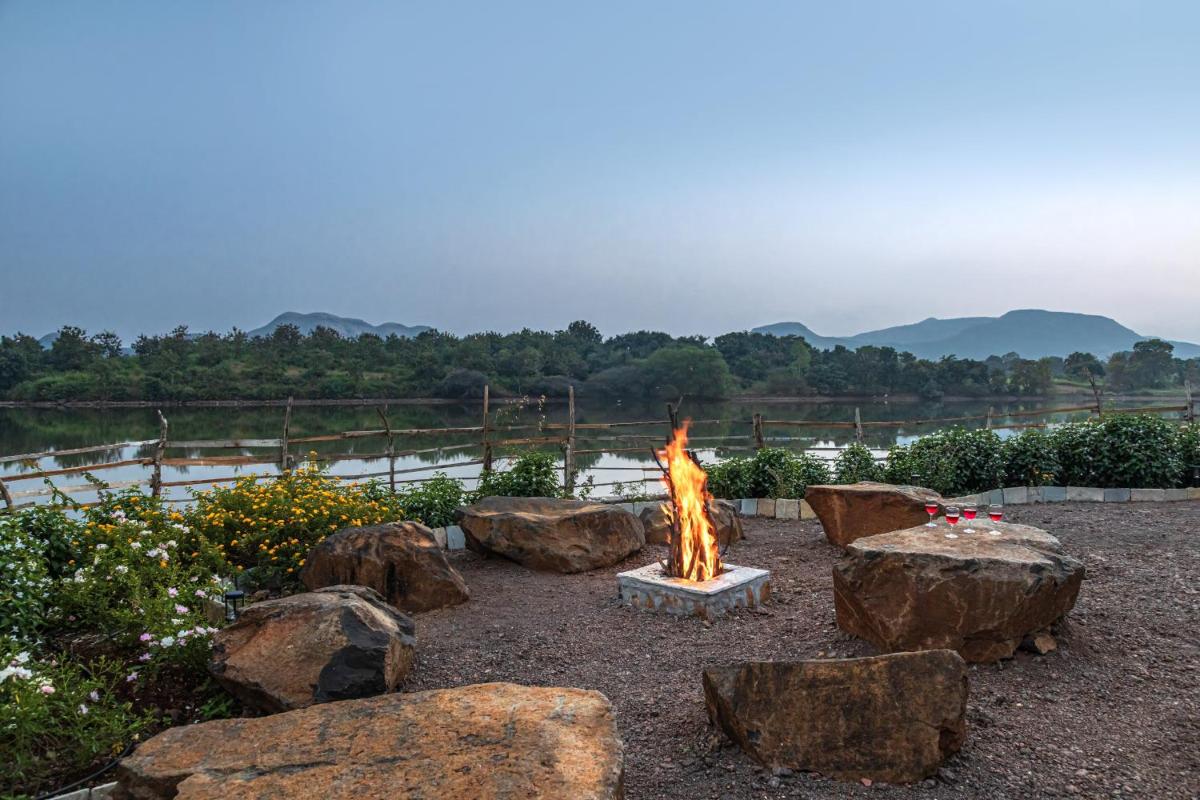SaffronStays Lake House Marigold, Nashik - rustic cottages with private plunge pool - Housity