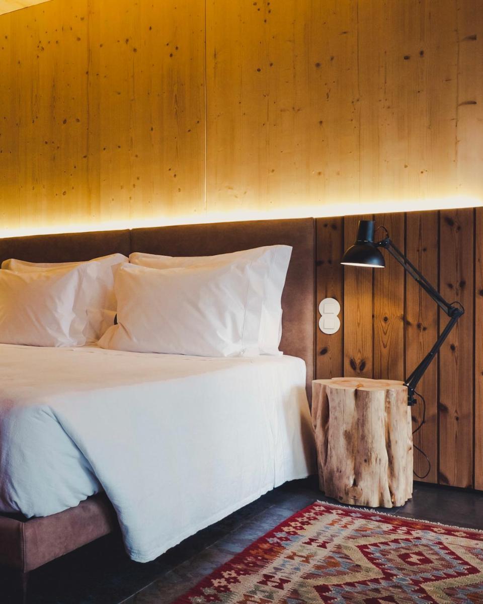 Uma cama ou camas num quarto em FeelViana Sport Hotel