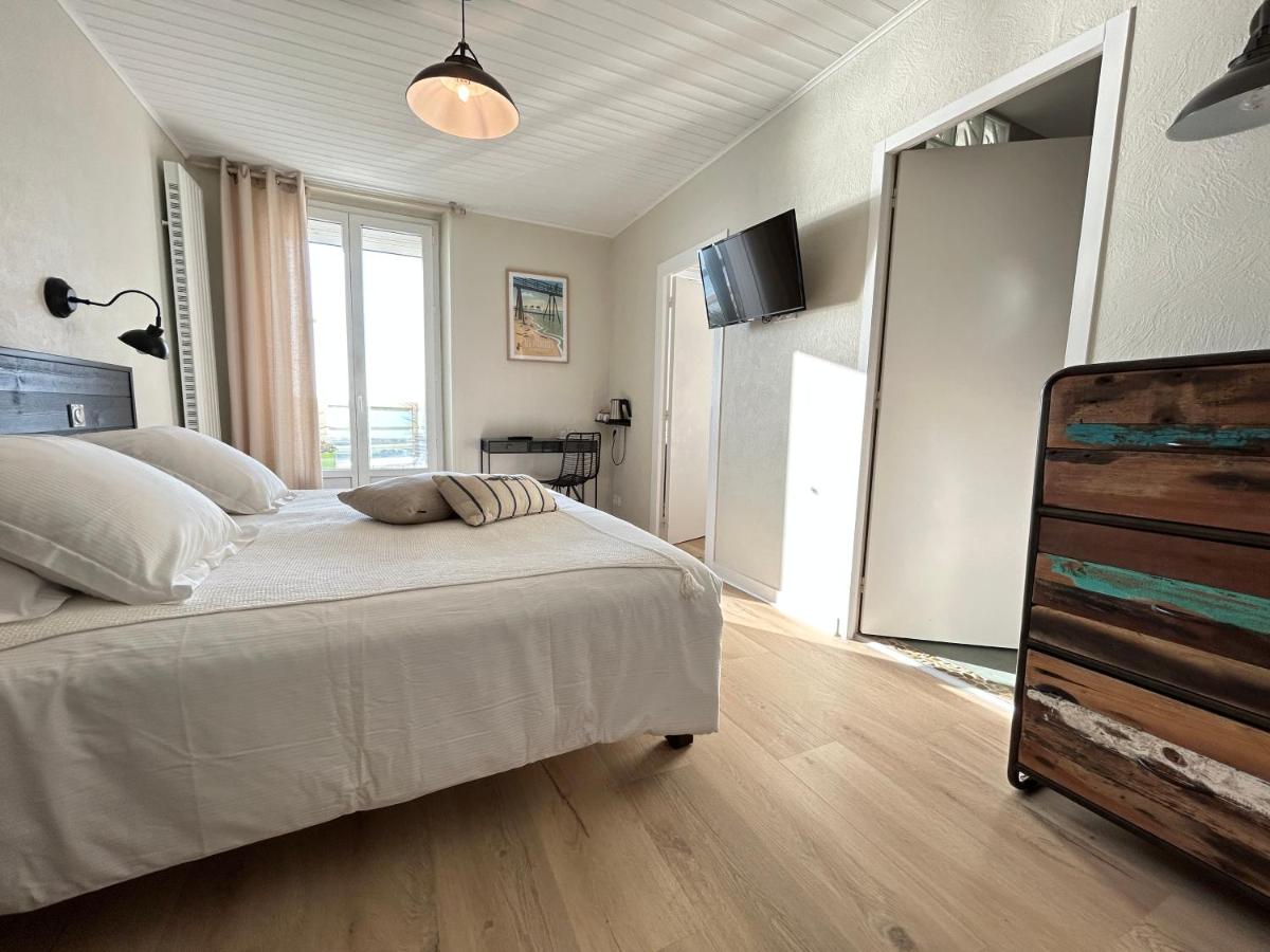 Un ou plusieurs lits dans un hébergement de l'établissement Hôtel de charme & SPA Le Grand Large