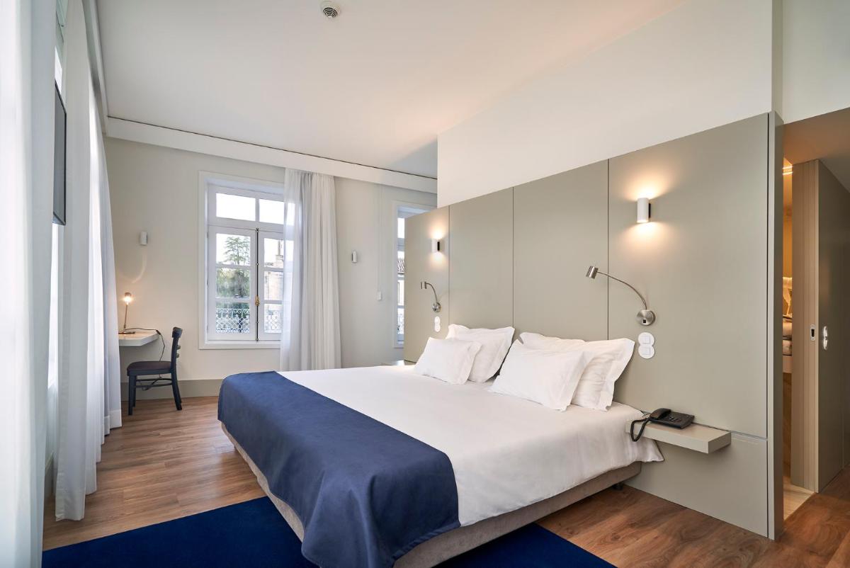 Uma cama ou camas num quarto em Ribeira Collection Hotel by Piamonte Hotels