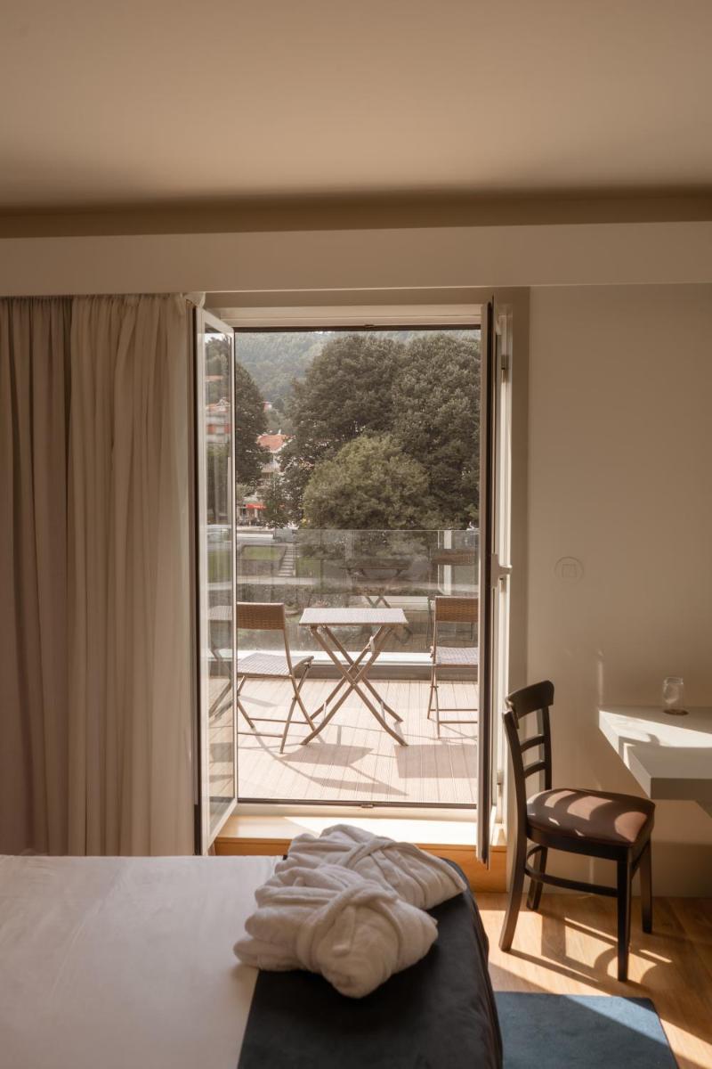 Uma cama ou camas num quarto em Ribeira Collection Hotel by Piamonte Hotels