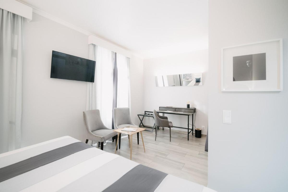 Uma televisão e/ou sistema de entretenimento em Sé Boutique Hotel