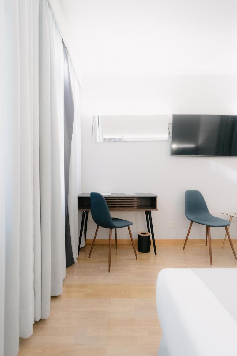 Uma televisão e/ou sistema de entretenimento em Sé Boutique Hotel