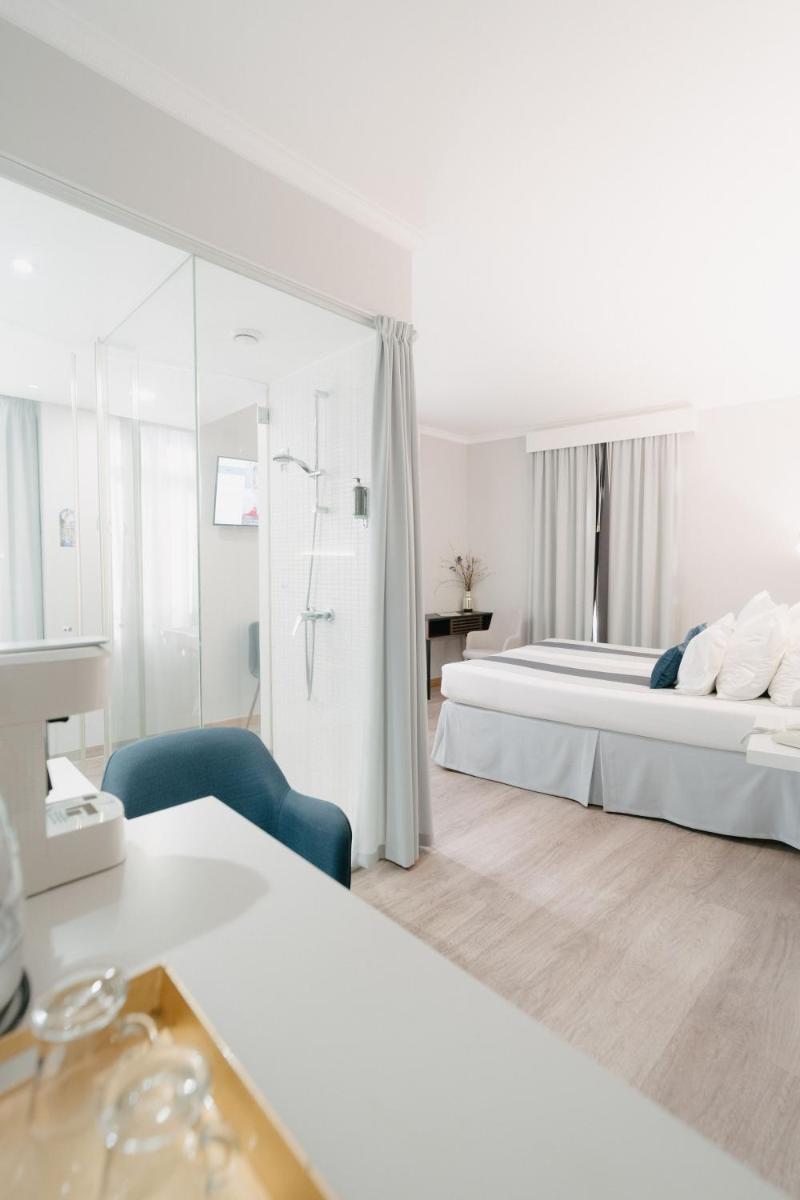 Uma cama ou camas num quarto em Sé Boutique Hotel