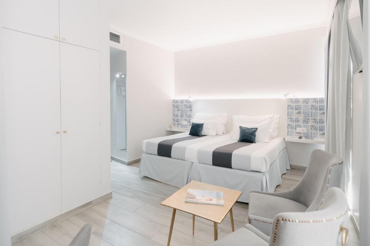 Uma cama ou camas num quarto em Sé Boutique Hotel