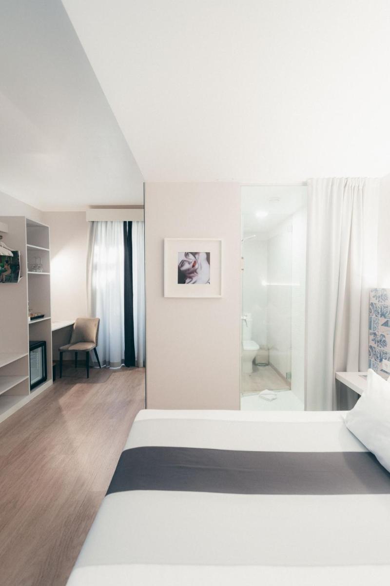 Uma cama ou camas num quarto em Sé Boutique Hotel