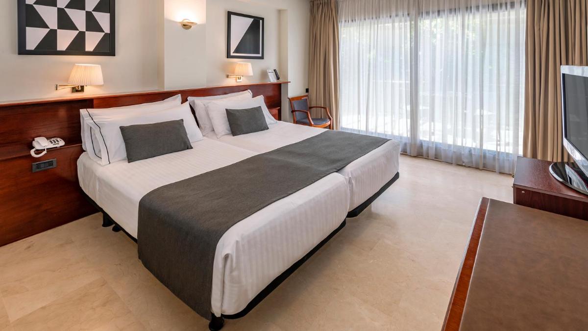 Cama o camas de una habitación en Gran Hotel Rey Don Jaime