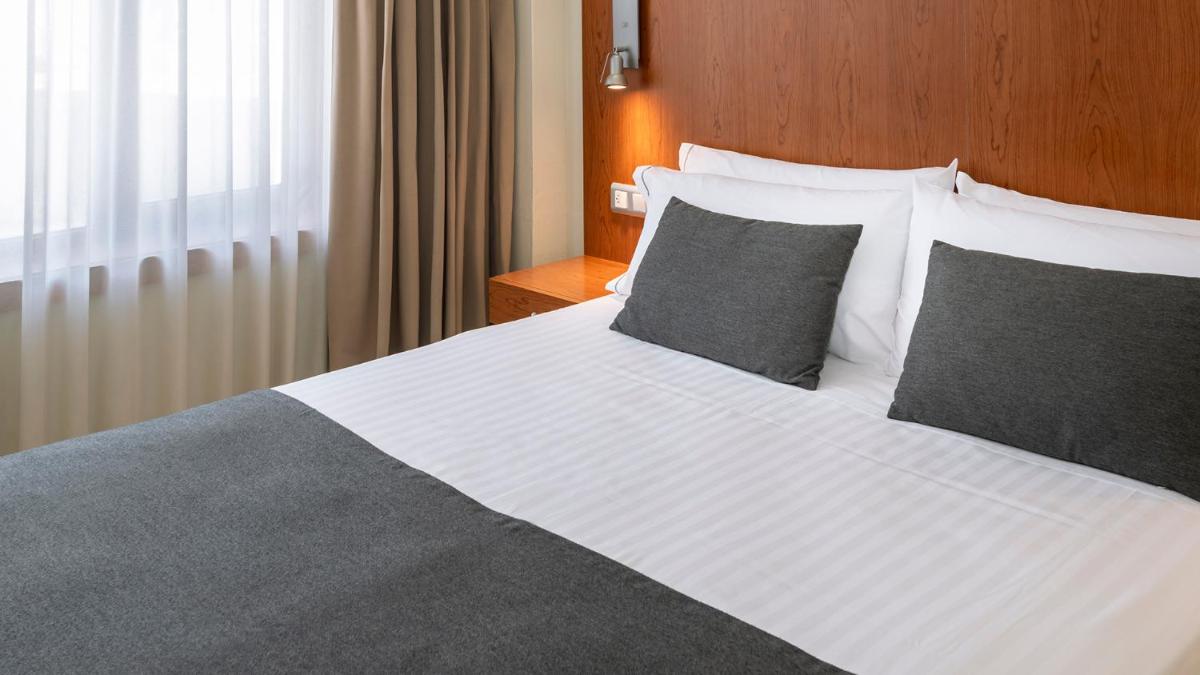 Cama o camas de una habitación en Gran Hotel Rey Don Jaime