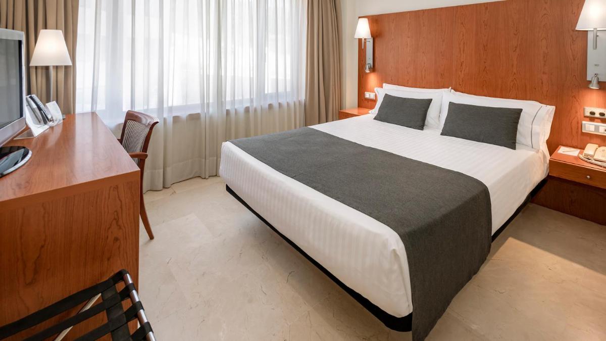 Cama o camas de una habitación en Gran Hotel Rey Don Jaime