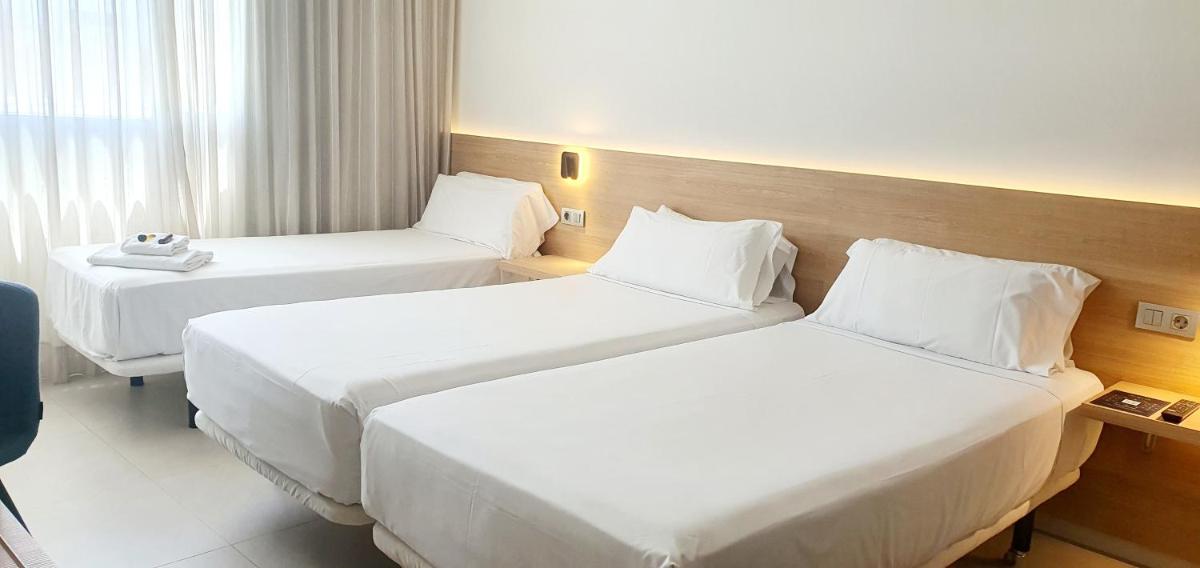 Cama o camas de una habitación en Hotel Areca