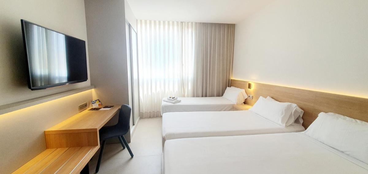 Cama o camas de una habitación en Hotel Areca