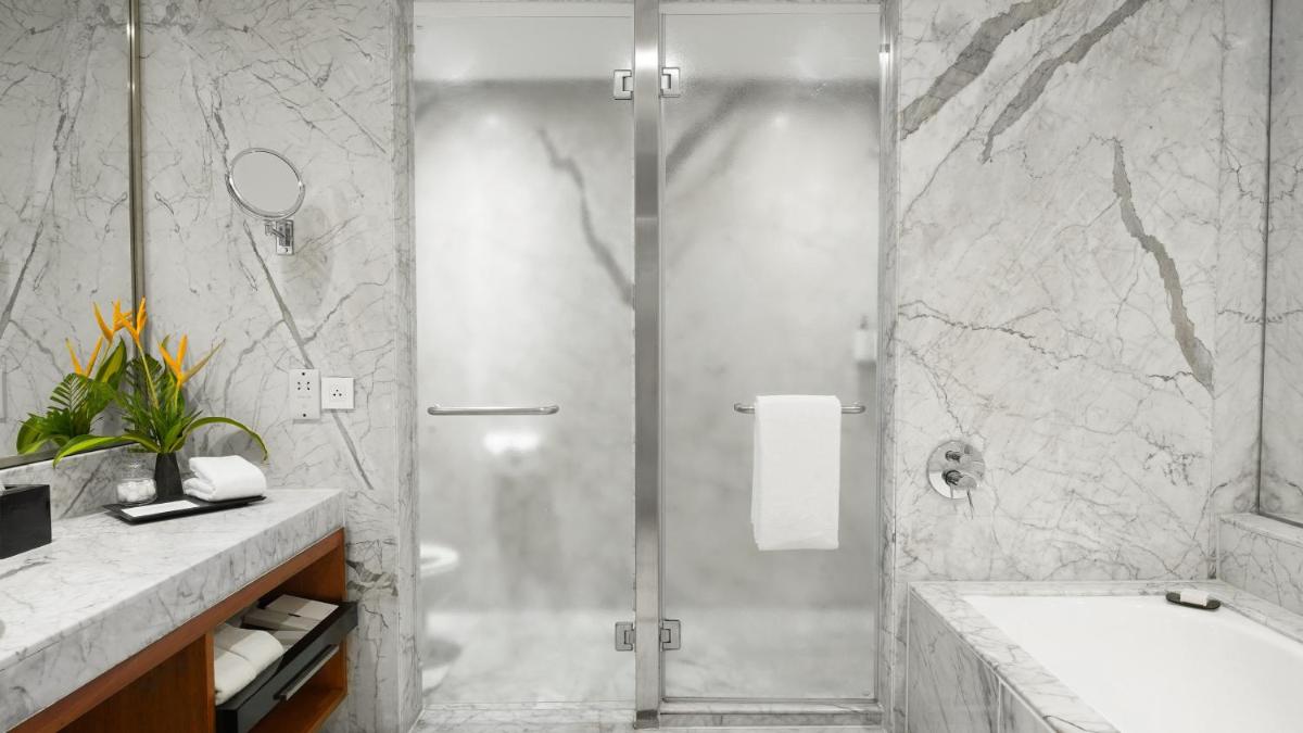 a bathroom with a shower and a sink at InterContinental Marine Drive Mumbai by IHG in Mumbai