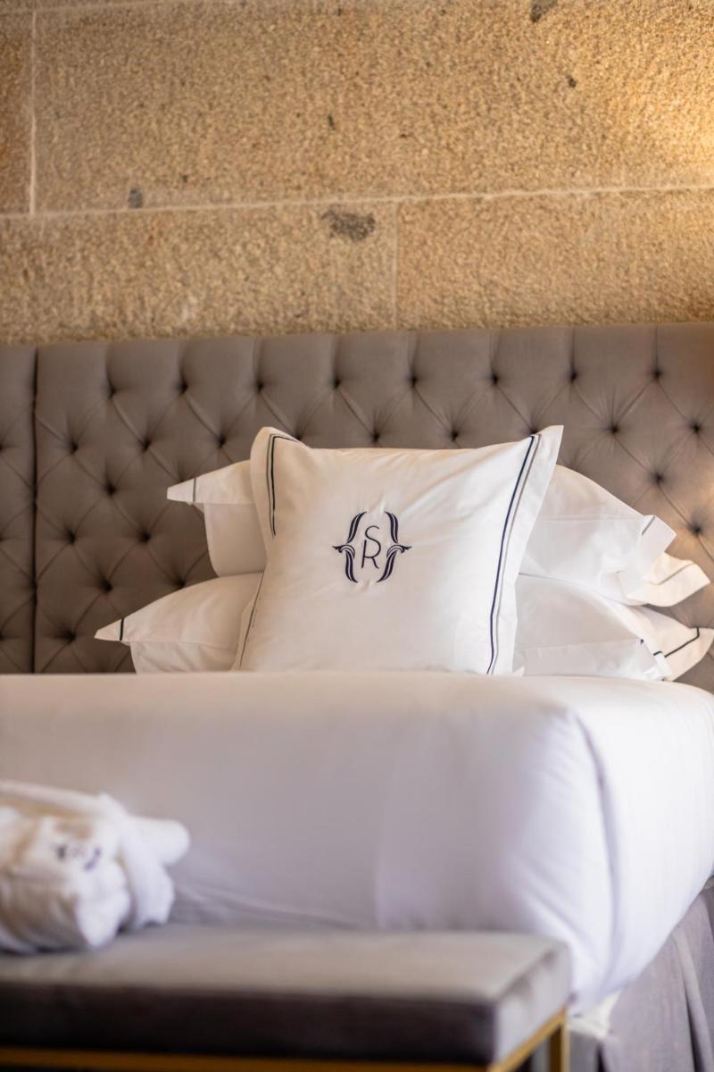 Uma cama ou camas num quarto em Solar do Requeijo by Luna Hotels & Resorts