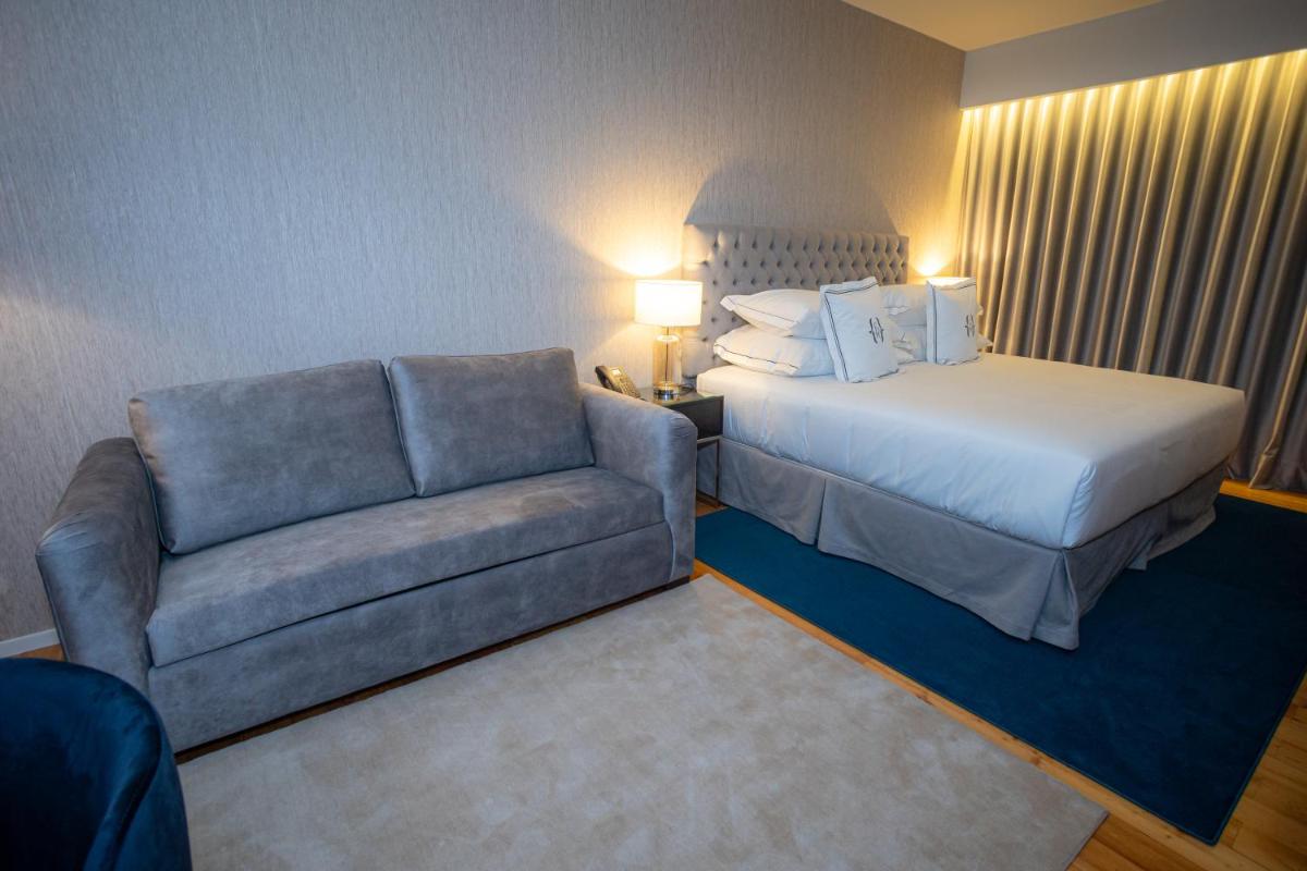 Uma cama ou camas num quarto em Solar do Requeijo by Luna Hotels & Resorts