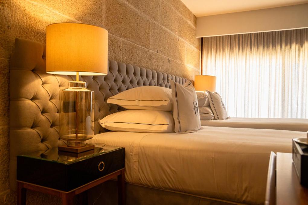 Uma cama ou camas num quarto em Solar do Requeijo by Luna Hotels & Resorts