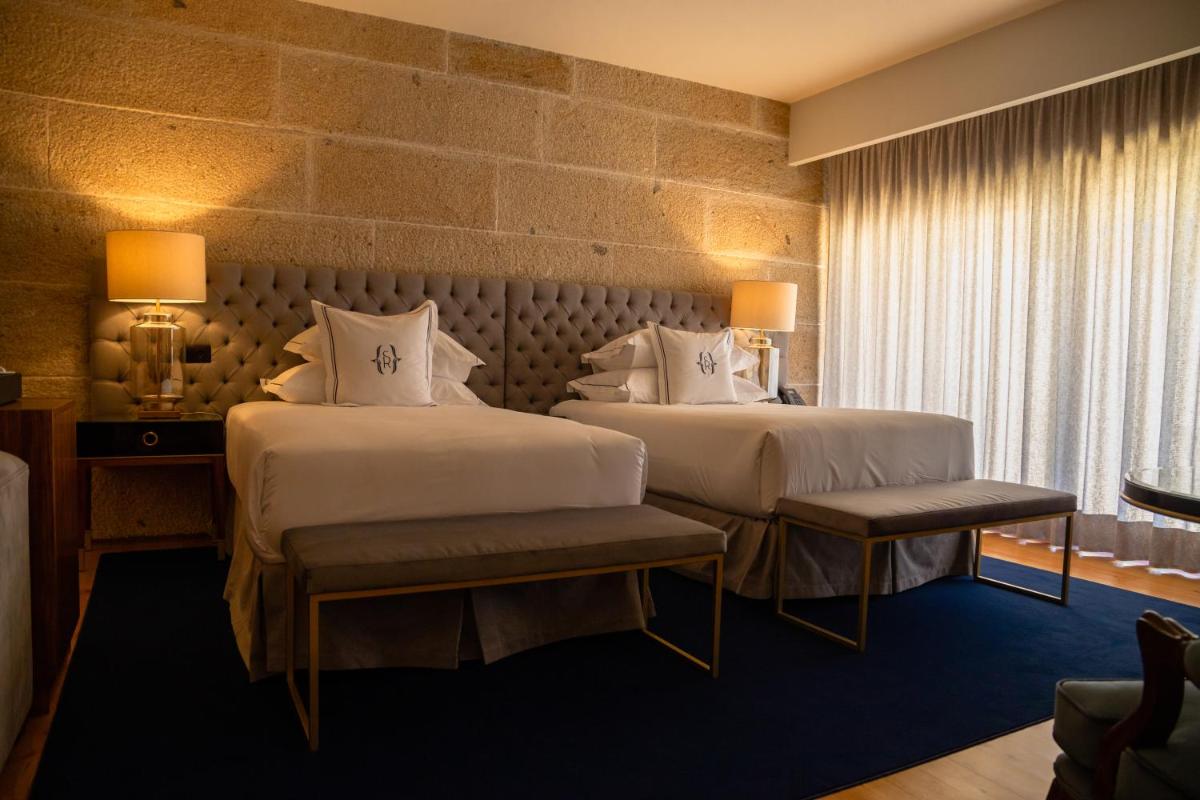 Uma cama ou camas num quarto em Solar do Requeijo by Luna Hotels & Resorts
