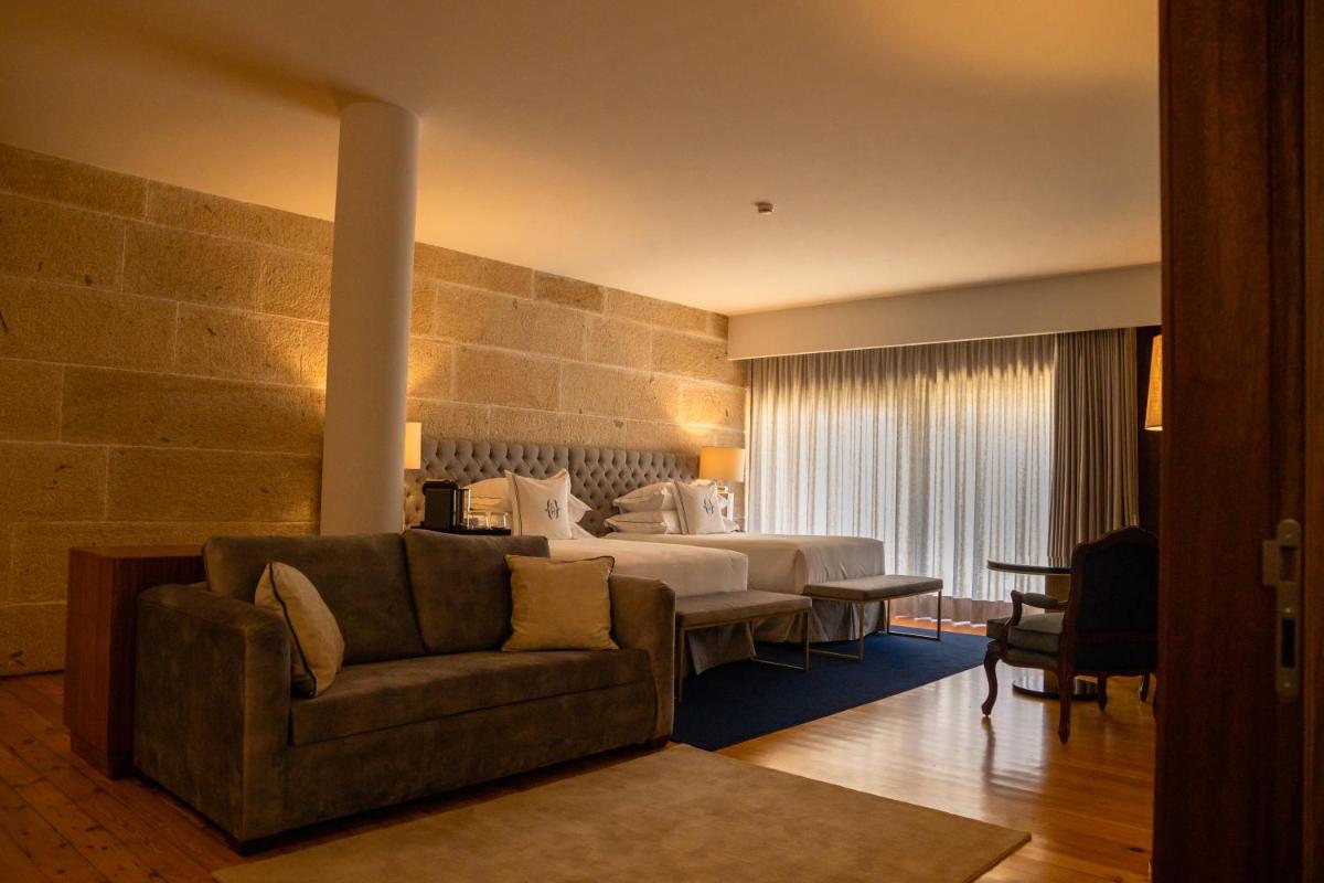 Uma cama ou camas num quarto em Solar do Requeijo by Luna Hotels & Resorts