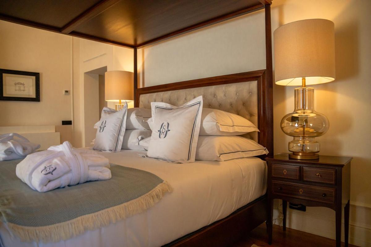 Uma cama ou camas num quarto em Solar do Requeijo by Luna Hotels & Resorts