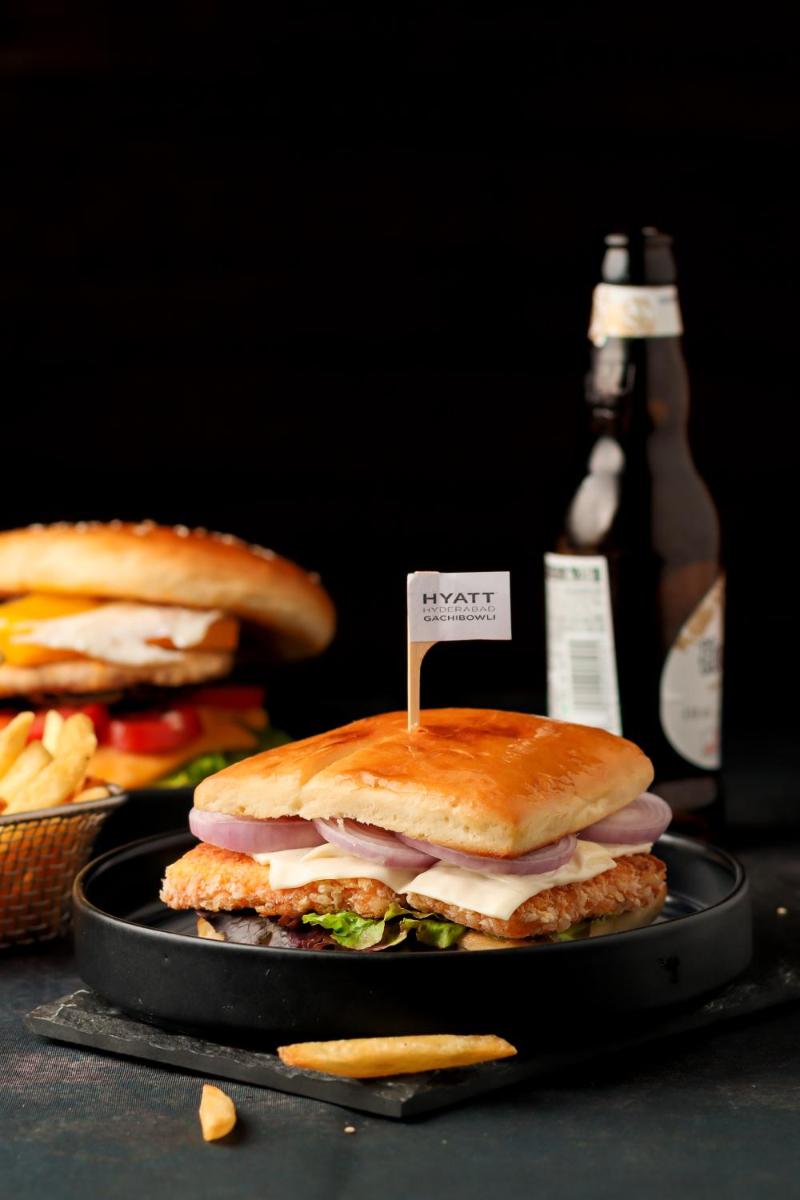 a sandwich on a plate with a sign on it at Hyatt Hyderabad Gachibowli in Hyderabad
