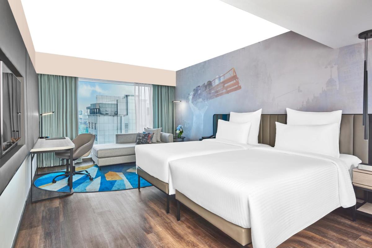 a rendering of a hotel room with a large bed at Novotel Mumbai International Airport in Mumbai