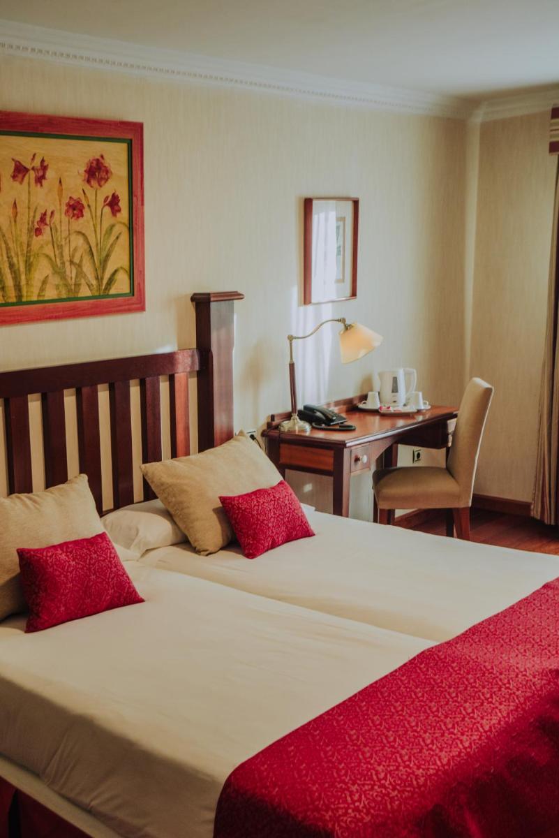 Cama o camas de una habitación en Hotel Spa Villalba