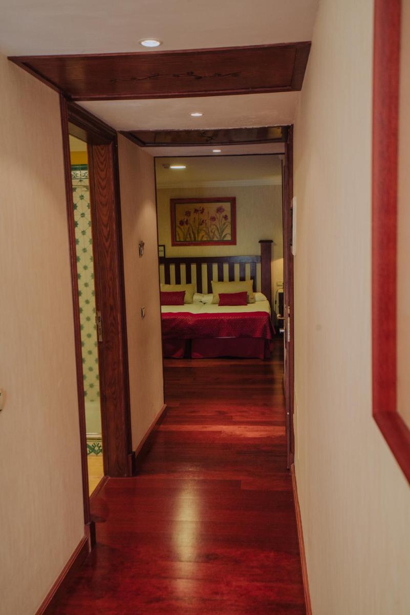 Cama o camas de una habitación en Hotel Spa Villalba