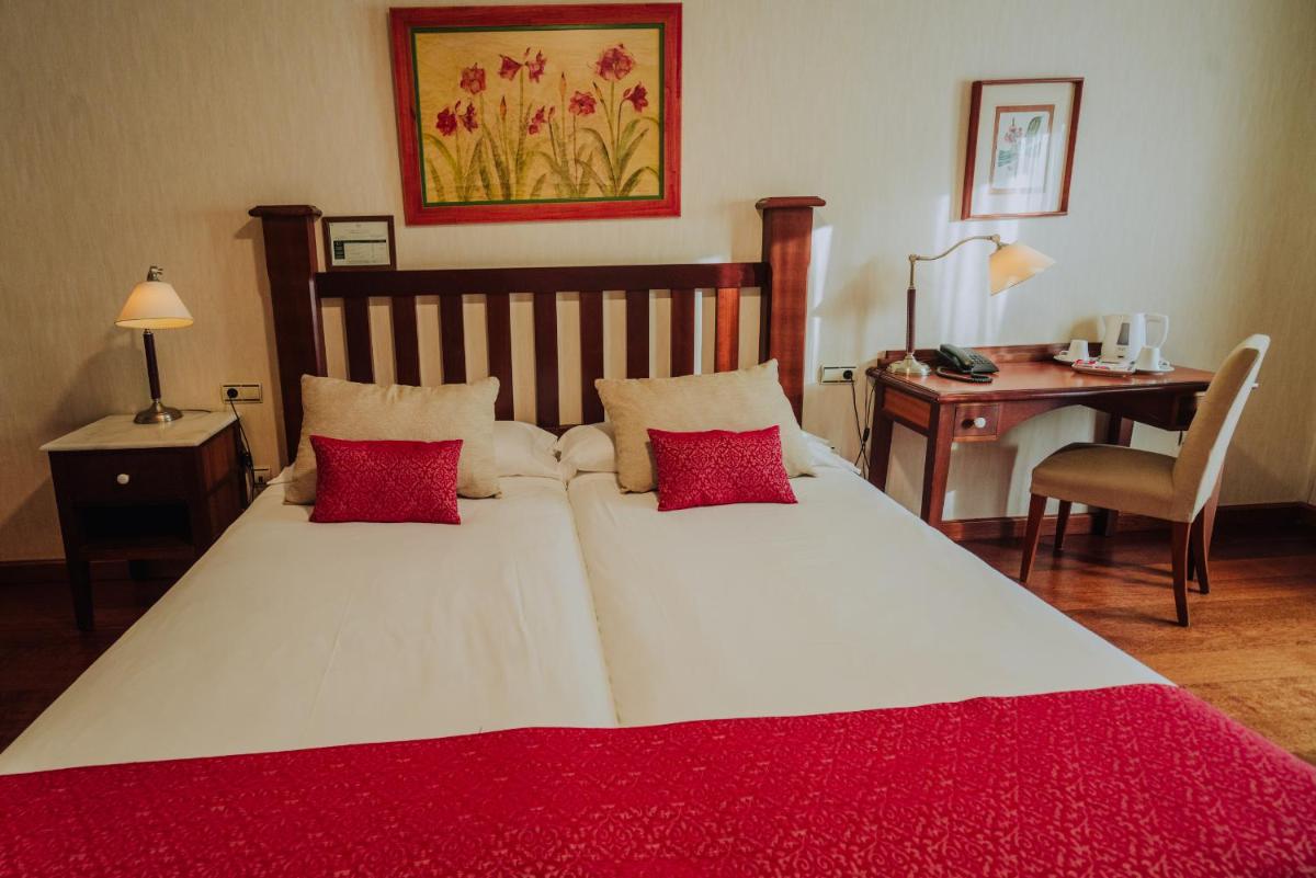 Cama o camas de una habitación en Hotel Spa Villalba