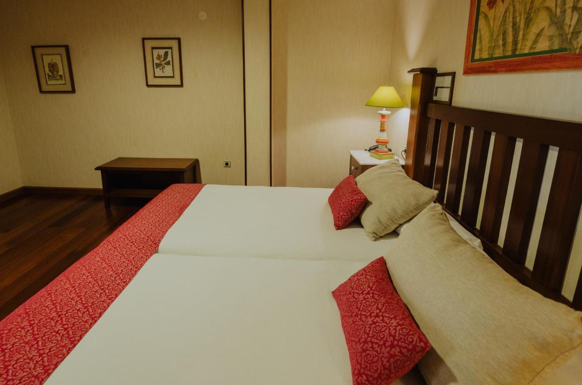 Cama o camas de una habitación en Hotel Spa Villalba