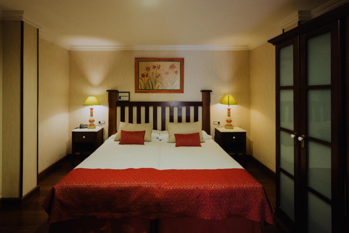Cama o camas de una habitación en Hotel Spa Villalba