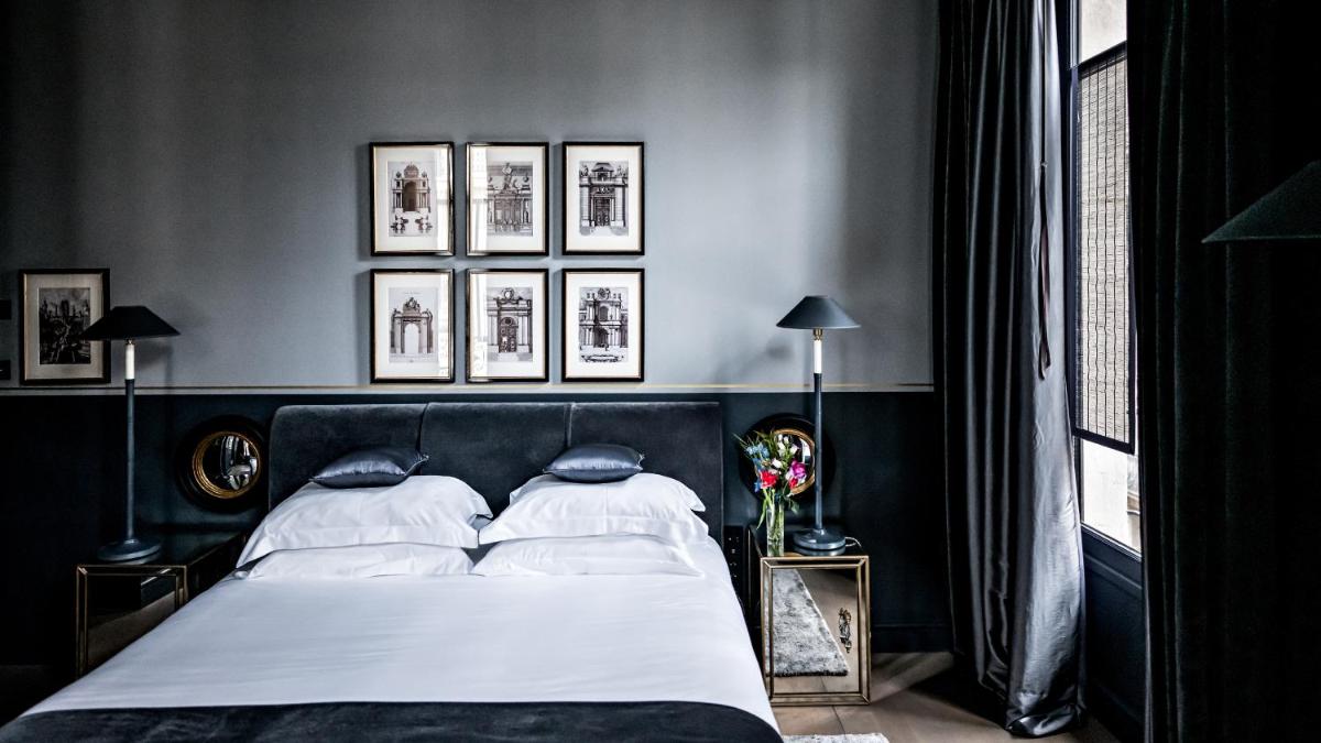 Un ou plusieurs lits dans un hébergement de l'établissement Monsieur George Hotel & Spa - Champs-Elysées