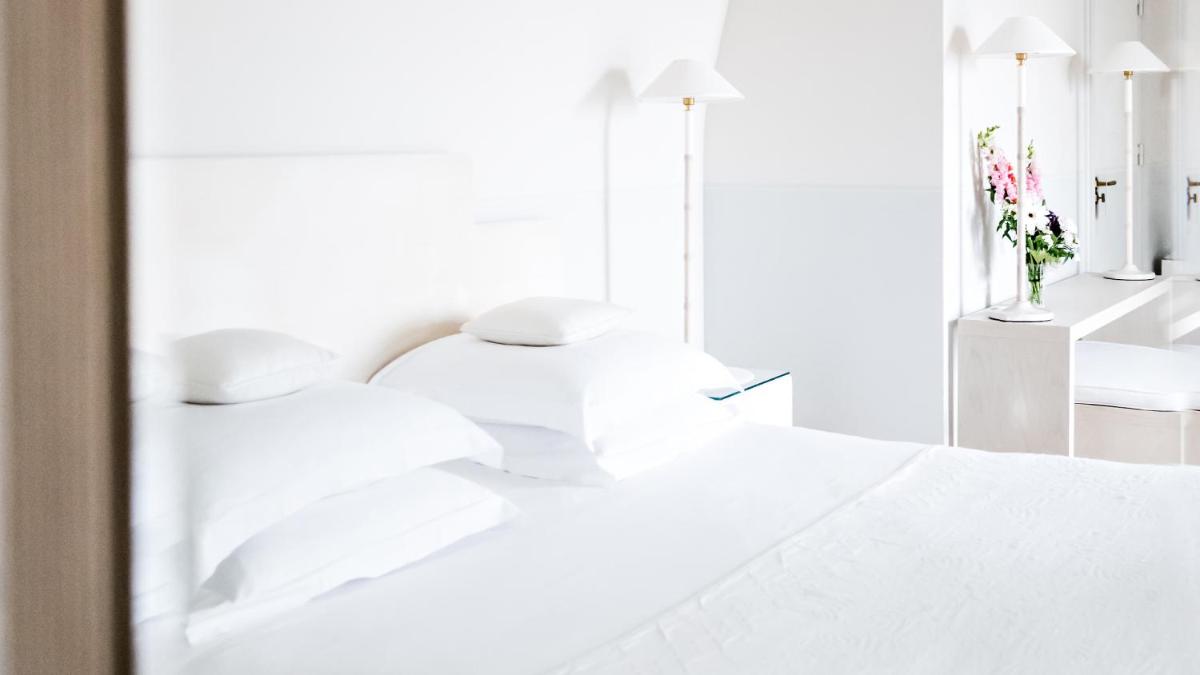 Un ou plusieurs lits dans un hébergement de l'établissement Monsieur George Hotel & Spa - Champs-Elysées