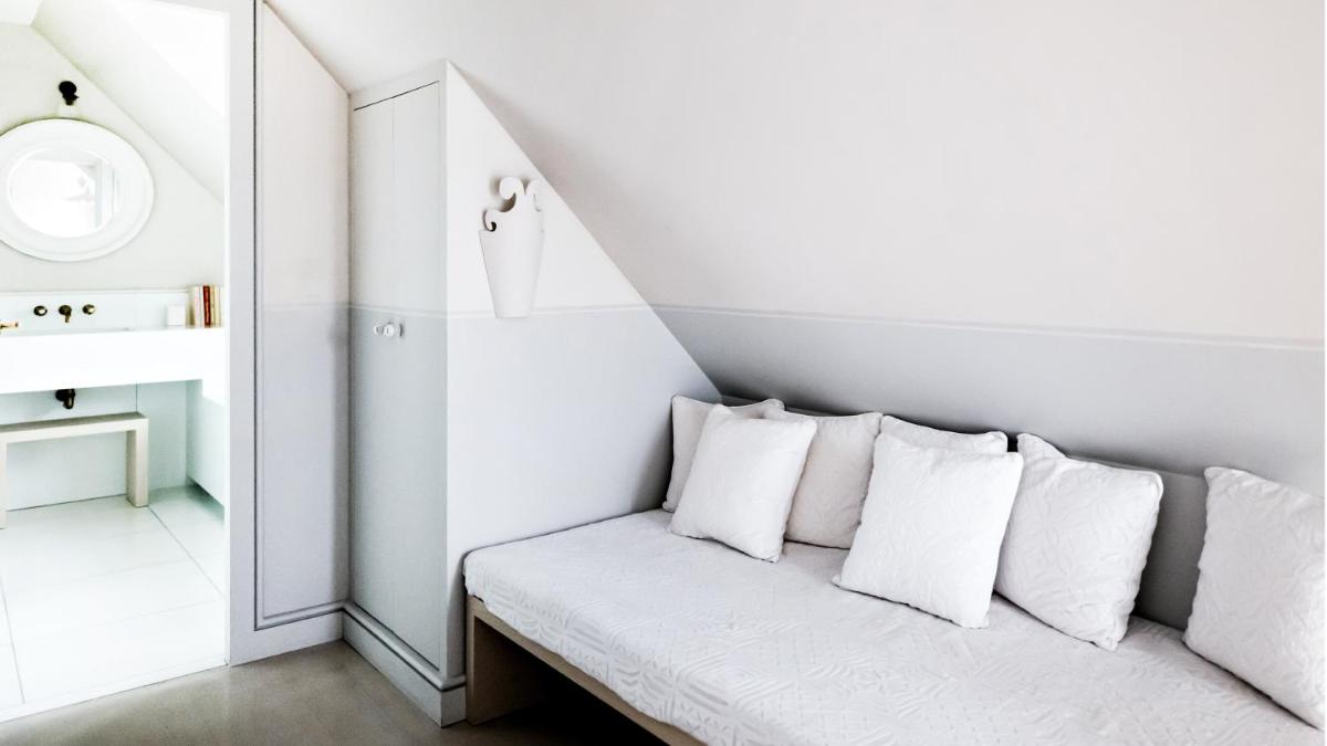 Un ou plusieurs lits dans un hébergement de l'établissement Monsieur George Hotel & Spa - Champs-Elysées