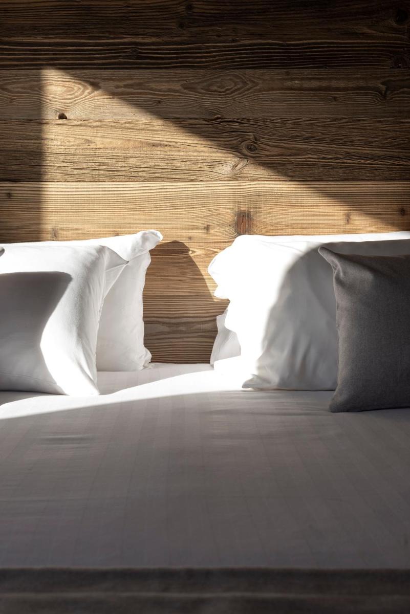 Un ou plusieurs lits dans un hébergement de l'établissement Hôtel et Spa Le Vermont
