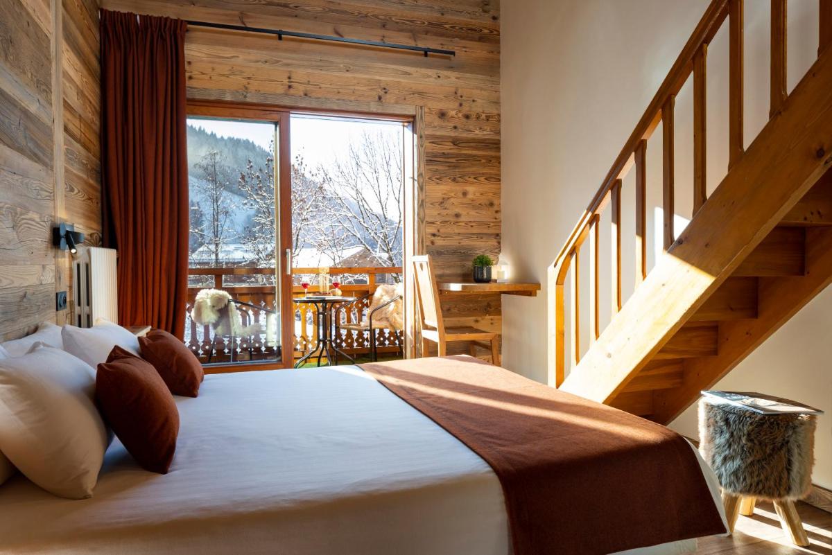 Un ou plusieurs lits dans un hébergement de l'établissement Hôtel et Spa Le Vermont