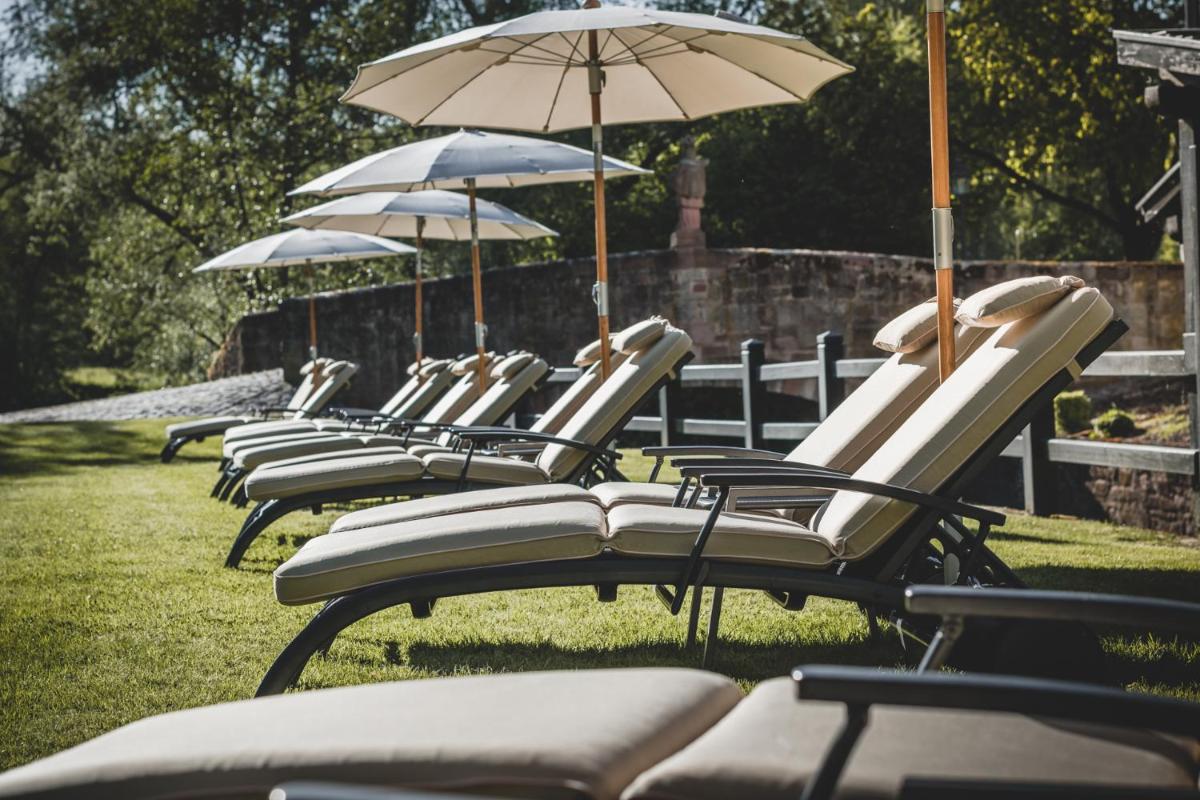 Ein Garten an der Unterkunft Neumühle Resort & Spa