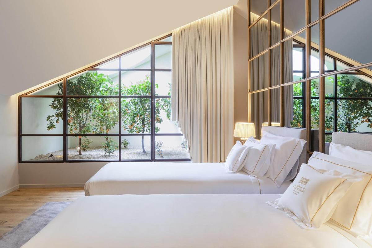 Uma cama ou camas num quarto em Casa da Companhia Hotel & Spa, Vignette Collection by IHG