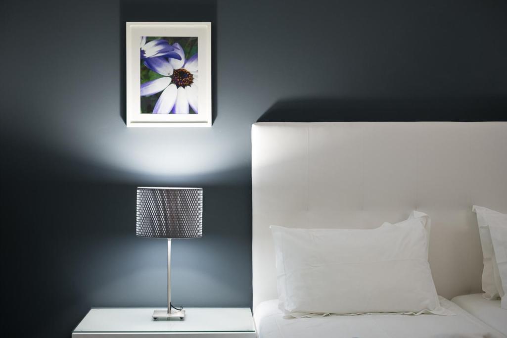Uma cama ou camas num quarto em Rocamar Exclusive Hotel & Spa - Adults Only
