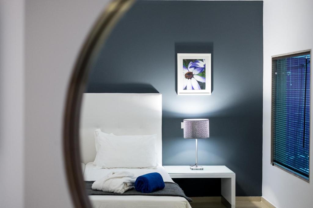 Uma cama ou camas num quarto em Rocamar Exclusive Hotel & Spa - Adults Only