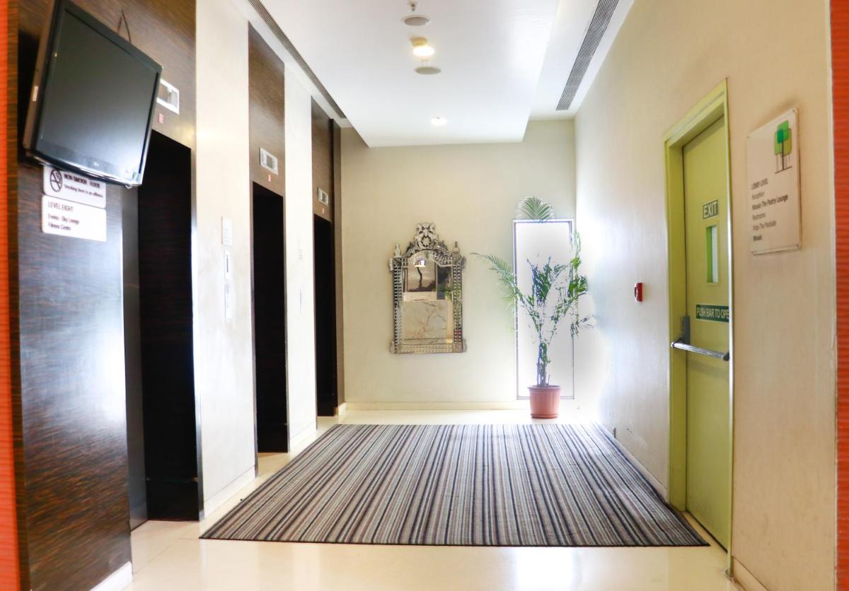 a hallway in a hospital with a tv on the wall at Crowne Plaza Pune City Centre by IHG in Pune