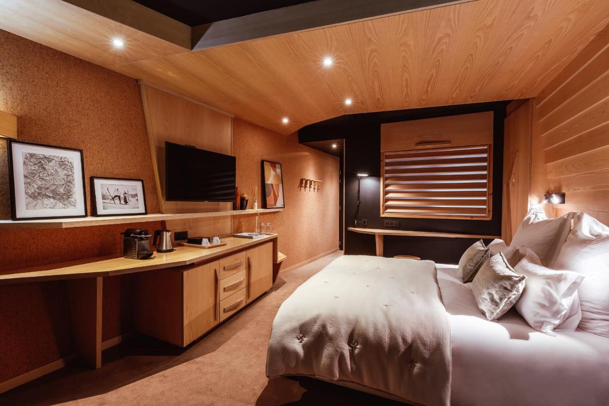 Un ou plusieurs lits dans un hébergement de l'établissement Altapura Hôtel & Spa Val Thorens
