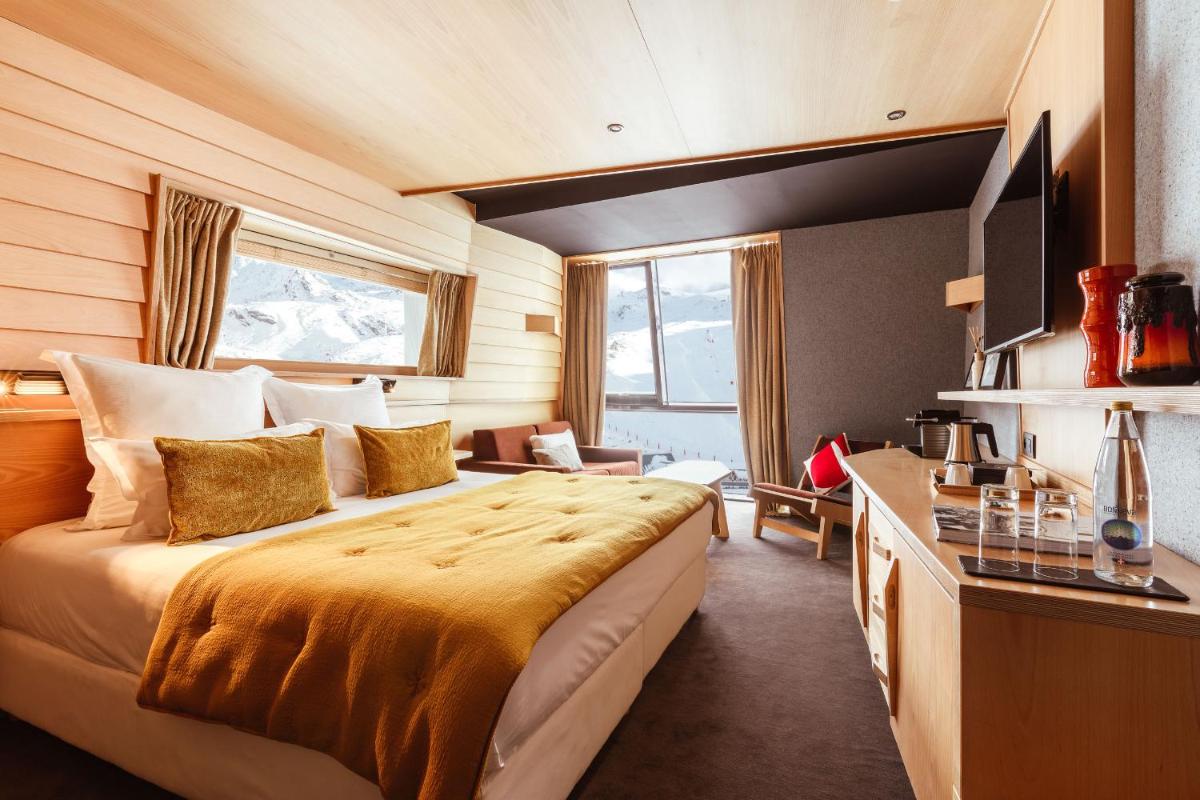 Un ou plusieurs lits dans un hébergement de l'établissement Altapura Hôtel & Spa Val Thorens